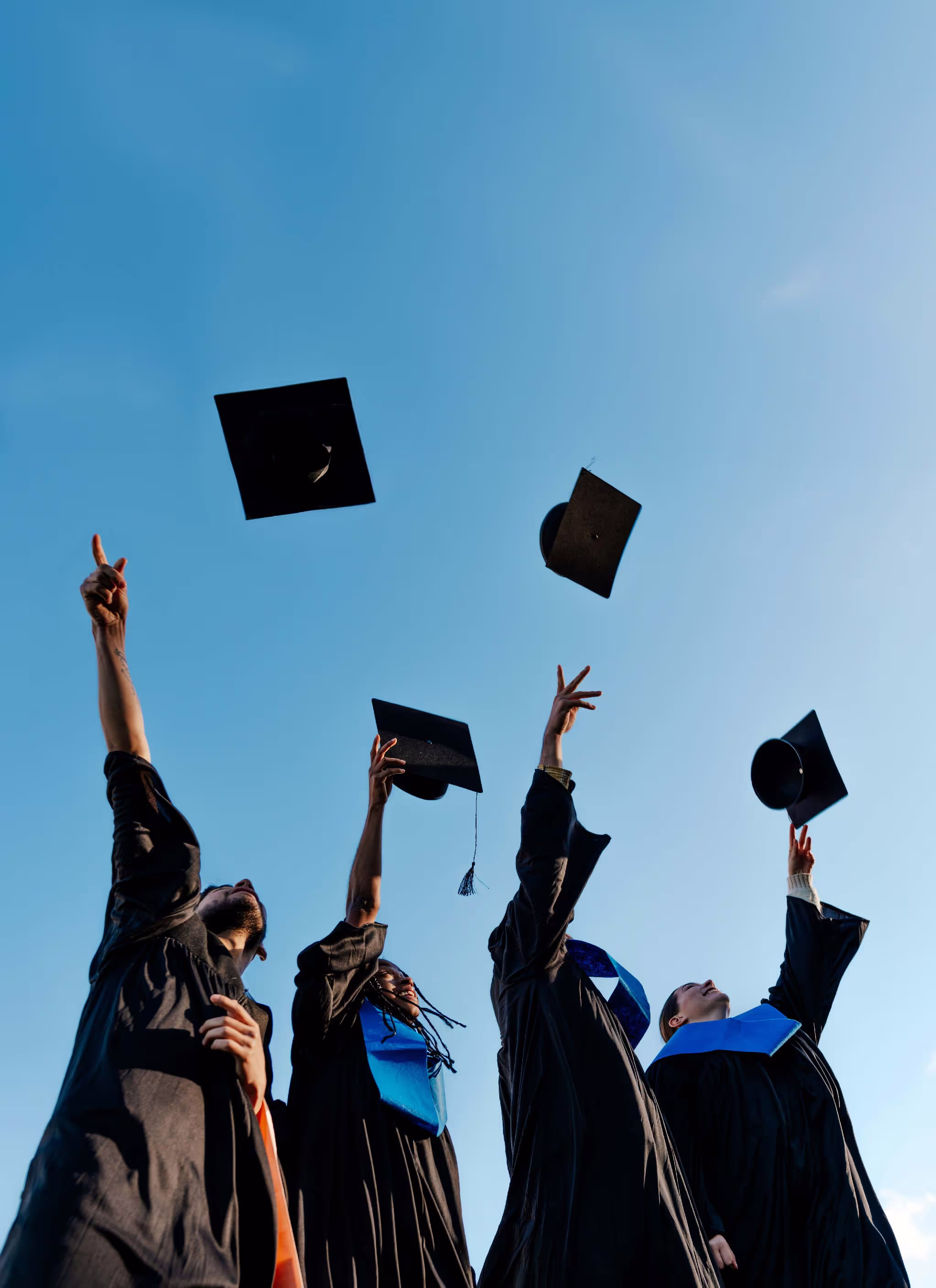 Students throwing their caps in the air