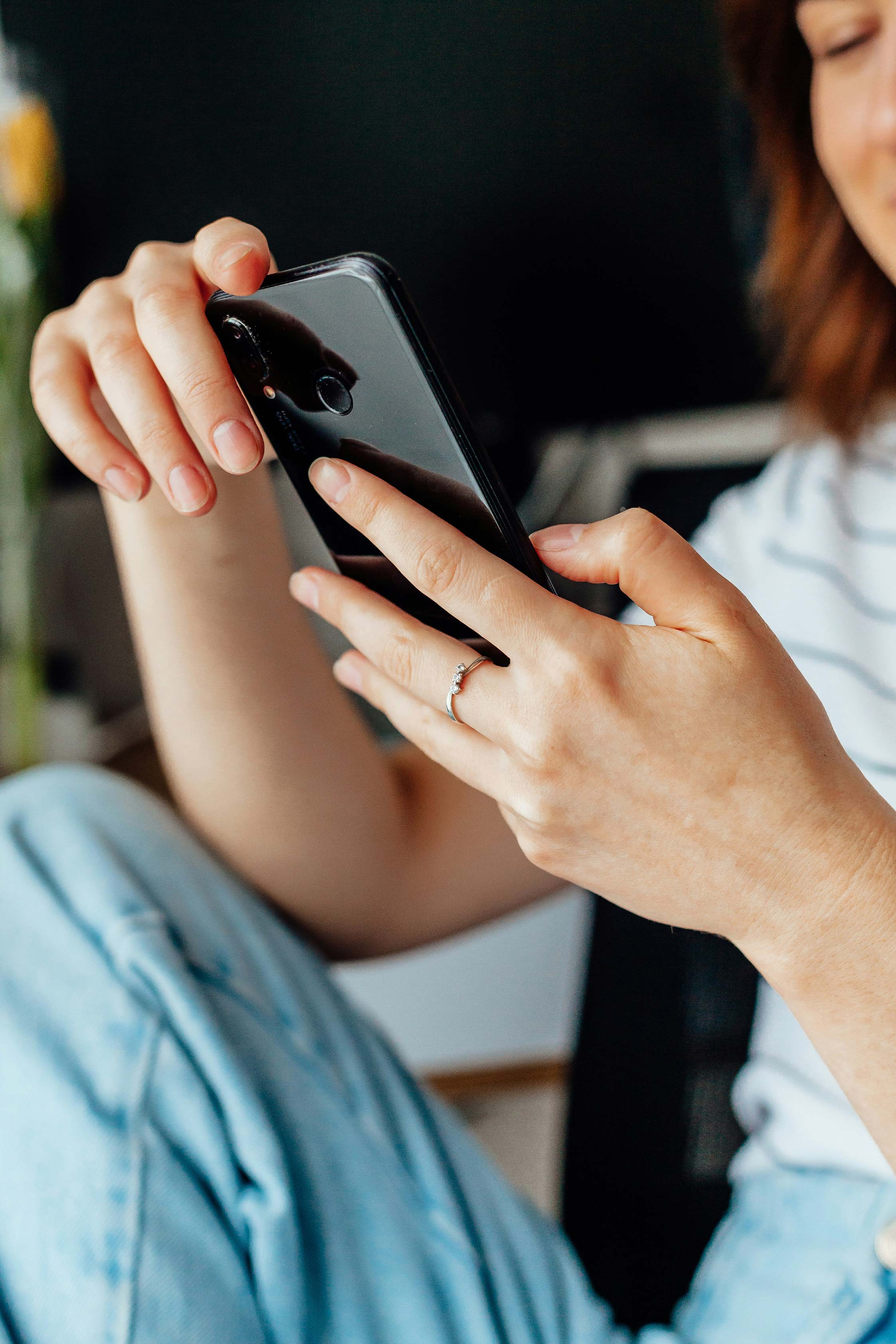 A close up of a person holding a cell phone